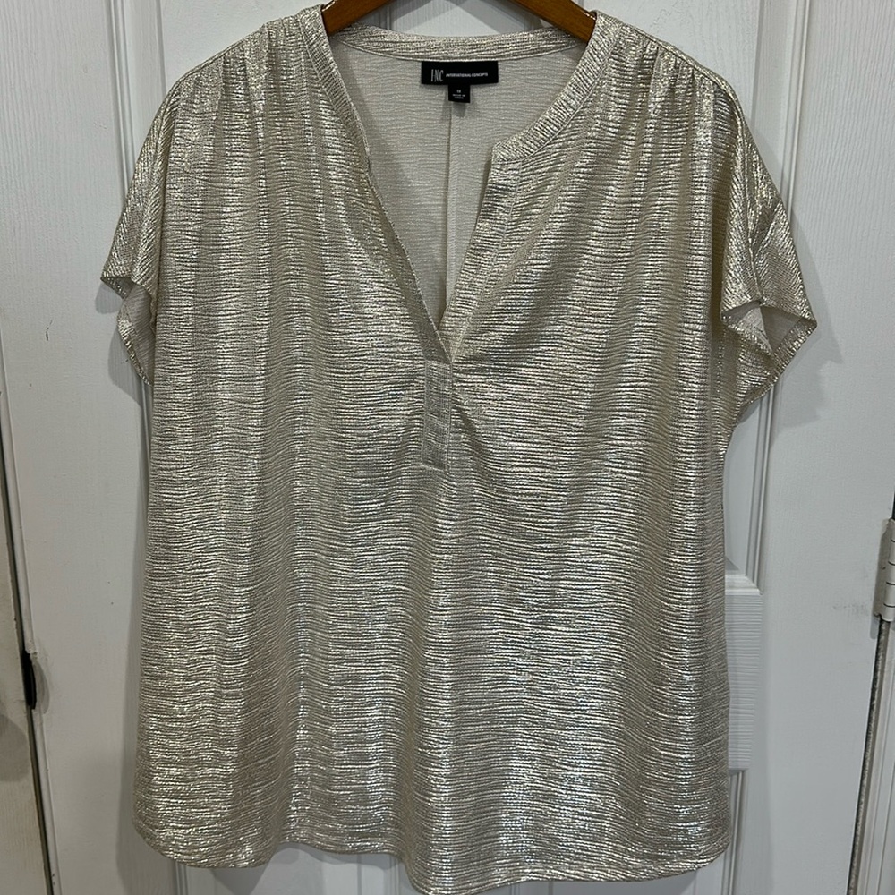 INC shimmery top. Beautiful, light weight and comfortable.  Gold tone.